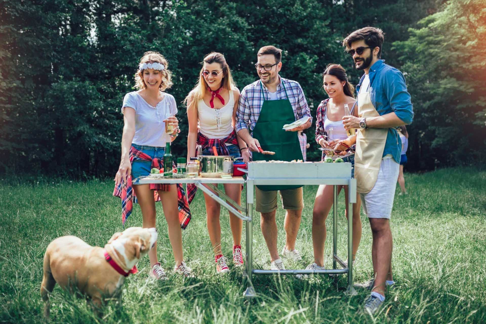 Family enjoying a cookout in their backyard, pest-free thanks to Pro Mosquito Solutions effective pest control and special event spray treatments.