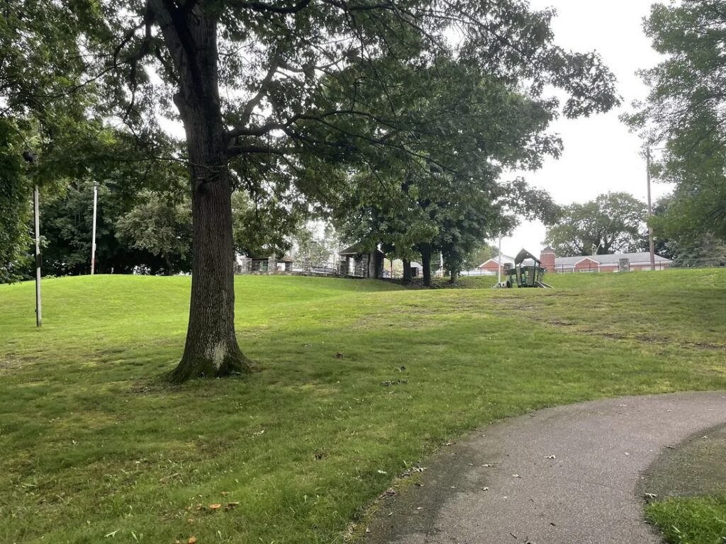 Peaceful view of Capt. Stephen Olney Memorial Park in North Providence, with open sports fields, a playground, and green spaces, honoring Captain Stephen Olney.
