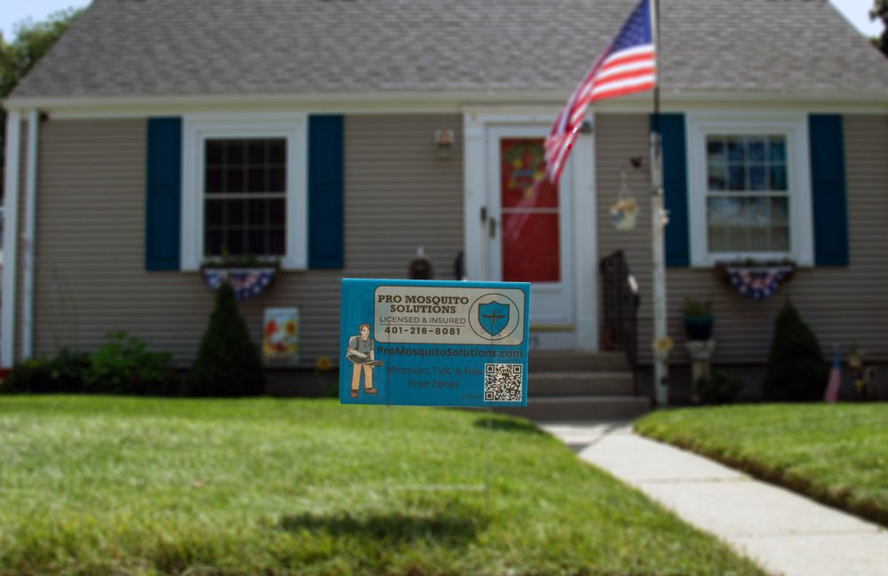 Pro Mosquito Solutions yard sign marking a mosquito, tick, and flea-free zone, showcasing effective pest control treatments for safe outdoor spaces.